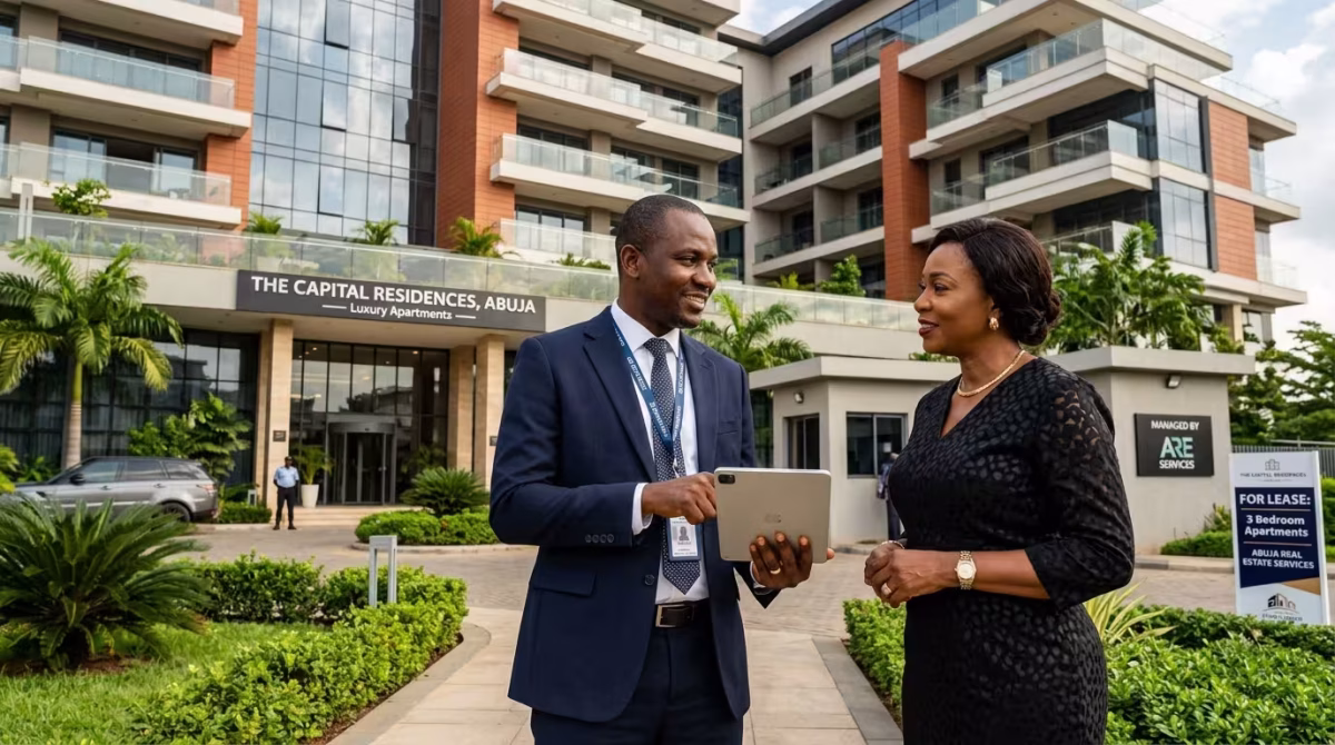 Property manager inspecting a modern apartment building in Nigeria