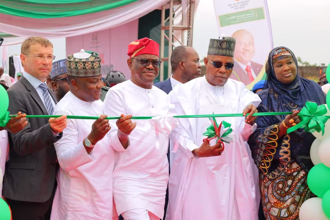 Government officials and stakeholders participate in a ribbon-cutting ceremony during the commissioning of a major infrastructure project in Abuja, highlighting investment in public development and urban growth.