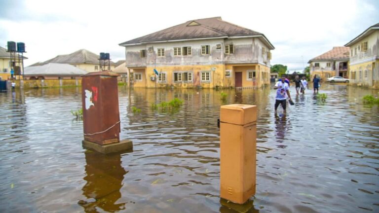 Flooded residential estate in Lagos with submerged roads and homes, highlighting the growing impact of urban flooding and the importance of climate-resilient property development.