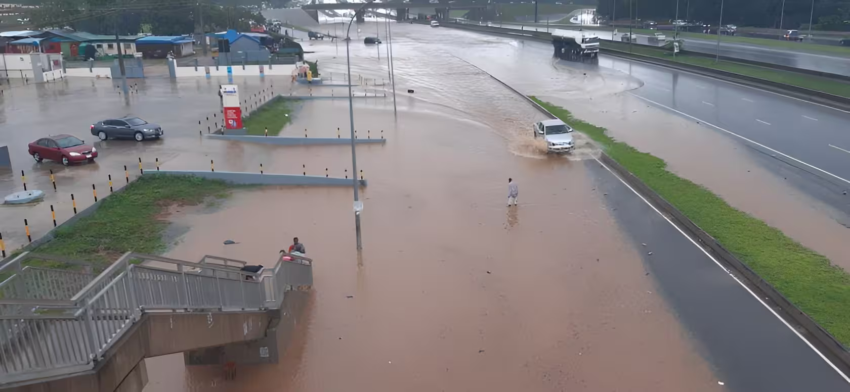Floodwater covering a road in Abuja after heavy rainfall on August 15, 2026
